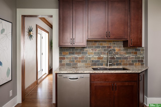 319 N 37th St, Omaha, NE 68131 - kitchen featuring stainless steel dishwasher, a sink, backsplash, baseboards, and wood finished floors