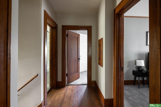 319 N 37th St, Omaha, NE 68131 - corridor with dark wood-style floors, an upstairs landing, and baseboards