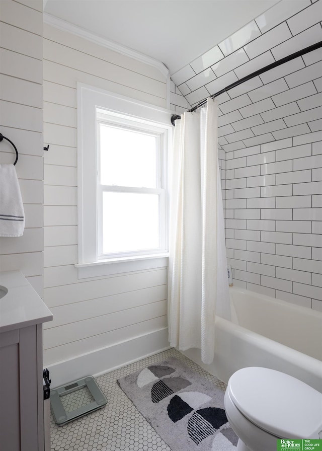 319 N 37th St, Omaha, NE 68131 - full bathroom featuring toilet, shower / bath combination with curtain, vanity, wood walls, and tile patterned floors