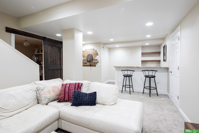 319 N 37th St, Omaha, NE 68131 - carpeted living room featuring a barn door, recessed lighting, baseboards, and bar