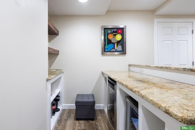 319 N 37th St, Omaha, NE 68131 - laundry room with dark wood-type flooring, wine cooler, and baseboards