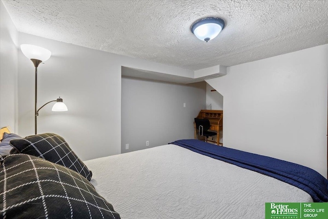 bedroom featuring a textured ceiling