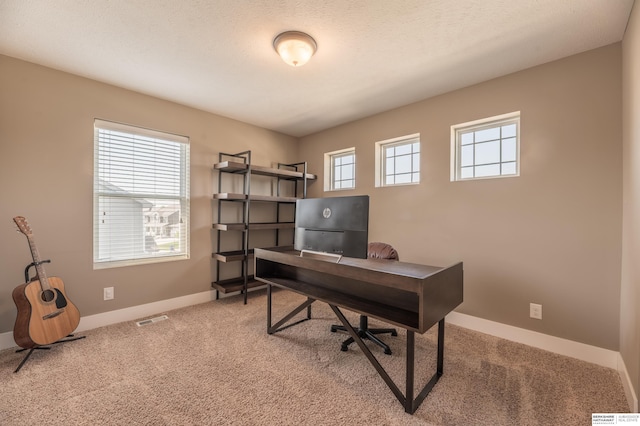 carpeted office with baseboards