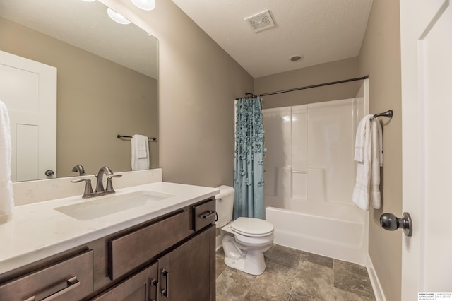 bathroom featuring toilet, vanity, shower / bathtub combination with curtain, baseboards, and stone finish flooring
