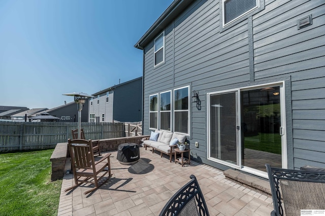 view of patio featuring an outdoor living space with a fire pit