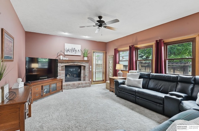 2103 John St, Papillion, NE 68133 - living room featuring carpet floors, ceiling fan, and a brick fireplace