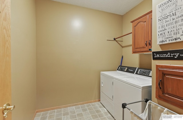 2103 John St, Papillion, NE 68133 - laundry area with independent washer and dryer, cabinet space, baseboards, and a textured ceiling