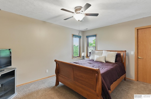 2103 John St, Papillion, NE 68133 - bedroom featuring carpet floors, baseboards, a ceiling fan, and a textured ceiling