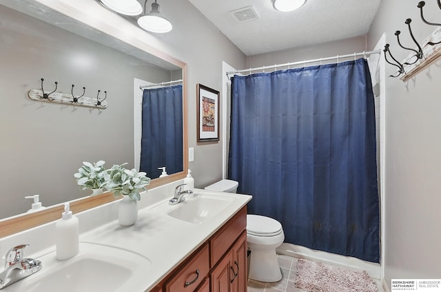 2103 John St, Papillion, NE 68133 - bathroom with toilet, double vanity, and tile patterned flooring