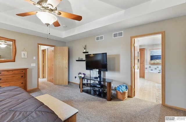 2103 John St, Papillion, NE 68133 - carpeted bedroom featuring baseboards and a raised ceiling