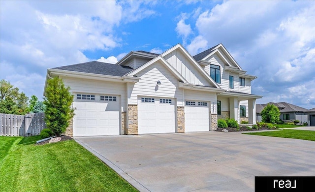 18880 Patrick Cir, Elkhorn, NE 68022 - craftsman-style home featuring board and batten siding, driveway, stone siding, and a garage