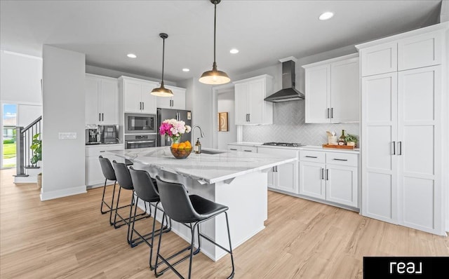 18880 Patrick Cir, Elkhorn, NE 68022 - kitchen with wall chimney range hood, stainless steel appliances, a sink, recessed lighting, and backsplash