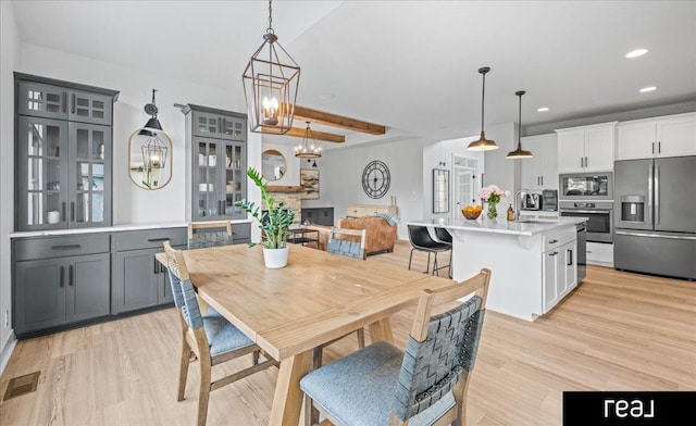 18880 Patrick Cir, Elkhorn, NE 68022 - dining area featuring light wood-type flooring, recessed lighting, and a chandelier
