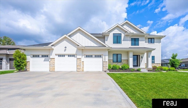 18880 Patrick Cir, Elkhorn, NE 68022 - view of front of home featuring board and batten siding, stone siding, concrete driveway, a front lawn, and an attached garage