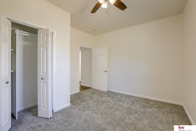 unfurnished bedroom featuring carpet floors, baseboards, and ceiling fan