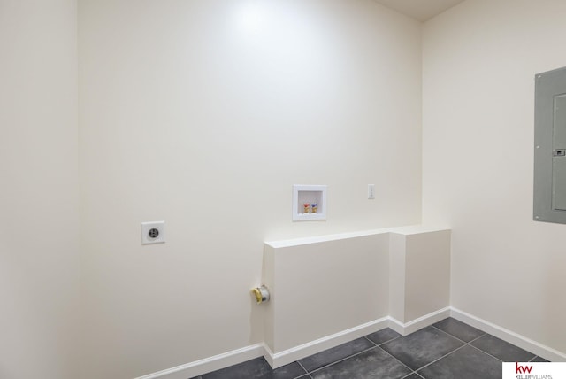 washroom with electric dryer hookup, hookup for a washing machine, dark tile patterned floors, electric panel, and baseboards