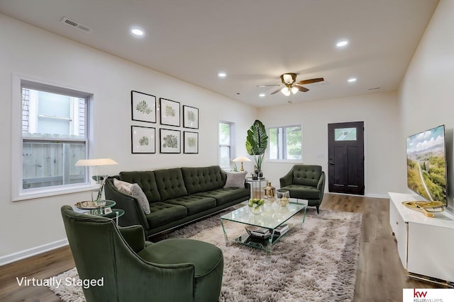 living room featuring wood finished floors, ceiling fan, recessed lighting, and baseboards