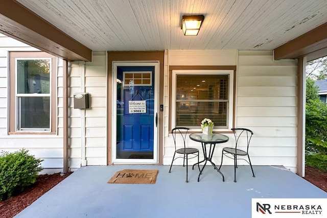 doorway to property with a porch