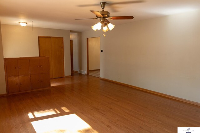 5 Fairview Dr, York, NE 68467 - spare room featuring light wood-type flooring, ceiling fan, and baseboards