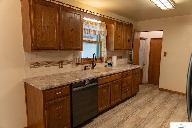 5 Fairview Dr, York, NE 68467 - kitchen featuring dishwashing machine, a sink, tasteful backsplash, and light countertops