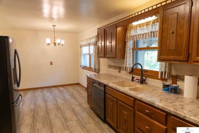 5 Fairview Dr, York, NE 68467 - kitchen with appliances with stainless steel finishes, a sink, plenty of natural light, and decorative backsplash