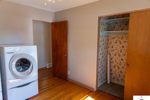 5 Fairview Dr, York, NE 68467 - clothes washing area with washer / dryer, light wood-type flooring, and baseboards