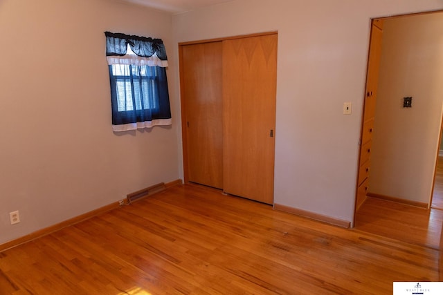 5 Fairview Dr, York, NE 68467 - unfurnished bedroom featuring light wood-style flooring, a closet, and baseboards