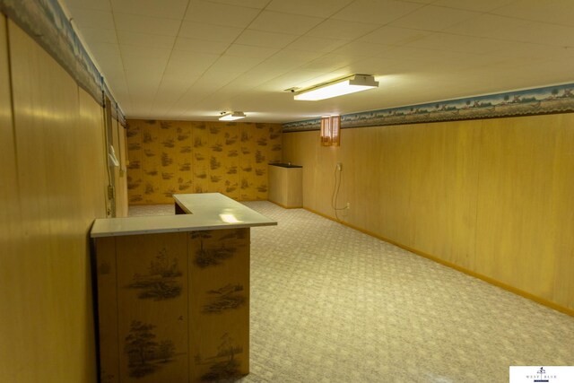 5 Fairview Dr, York, NE 68467 - finished basement featuring carpet floors, wallpapered walls, and bar area