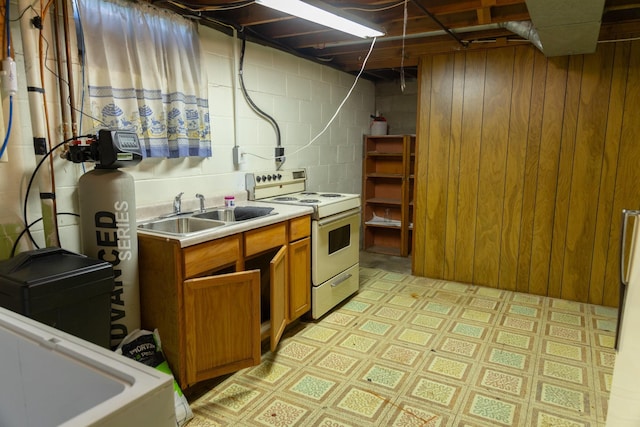5 Fairview Dr, York, NE 68467 - kitchen featuring white electric stove, a sink, light flooring, brown cabinets, and light countertops