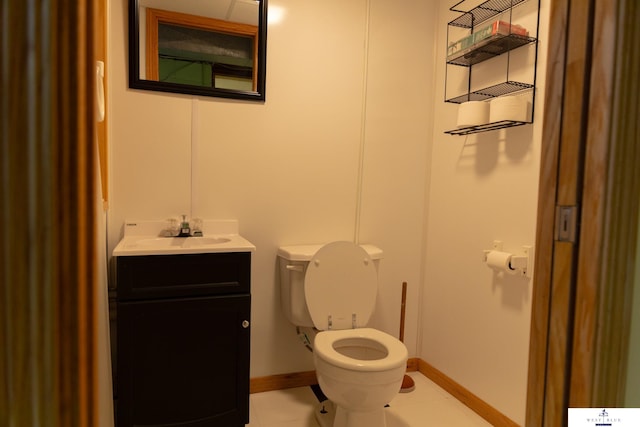 5 Fairview Dr, York, NE 68467 - bathroom with toilet, baseboards, vanity, and tile patterned floors
