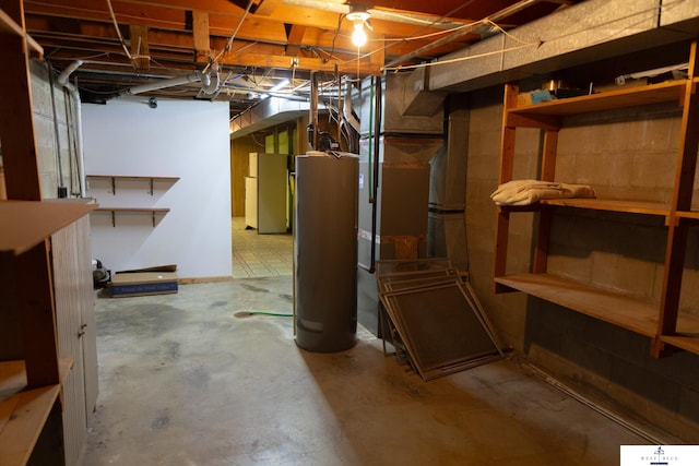 5 Fairview Dr, York, NE 68467 - unfinished below grade area with freestanding refrigerator and water heater
