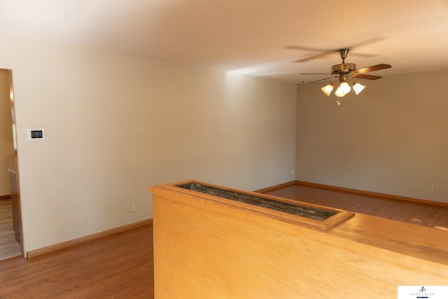 5 Fairview Dr, York, NE 68467 - kitchen with light wood-style floors, ceiling fan, and baseboards