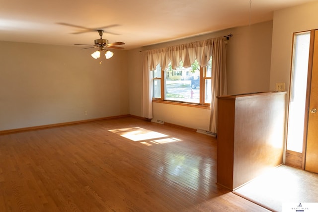 5 Fairview Dr, York, NE 68467 - empty room featuring ceiling fan, wood finished floors, and baseboards