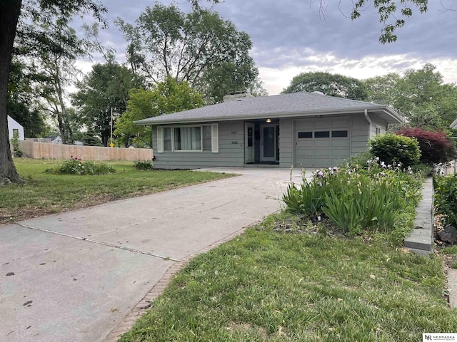 1801 Franklin St, Bellevue, NE 68005 - view of front of home featuring an attached garage and concrete driveway