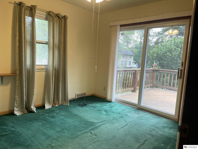 1801 Franklin St, Bellevue, NE 68005 - carpeted spare room with baseboards and a ceiling fan