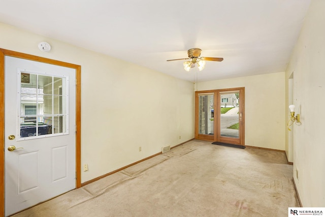 1801 Franklin St, Bellevue, NE 68005 - carpeted entrance foyer with baseboards and a ceiling fan