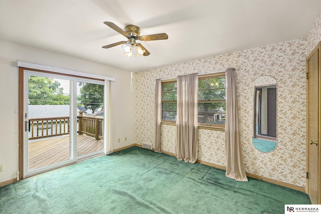 1801 Franklin St, Bellevue, NE 68005 - carpeted empty room with healthy amount of natural light, baseboards, a ceiling fan, and wallpapered walls
