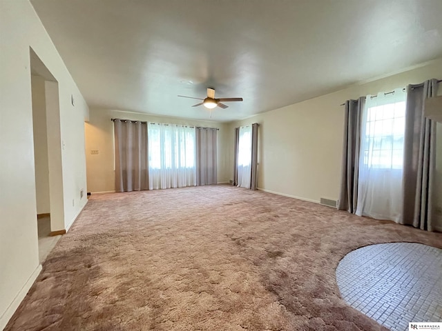1801 Franklin St, Bellevue, NE 68005 - carpeted empty room featuring a ceiling fan and baseboards