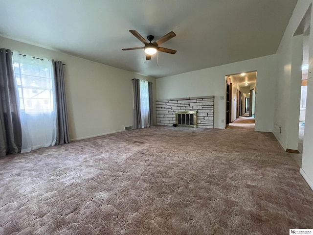 1801 Franklin St, Bellevue, NE 68005 - unfurnished living room with ceiling fan, carpet flooring, a fireplace, and baseboards