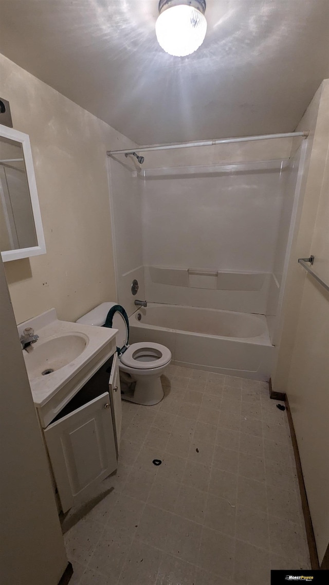 bathroom featuring bathtub / shower combination, vanity, toilet, and tile patterned floors