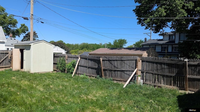 view of yard with a shed and an outbuilding