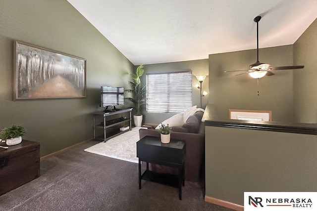 living room with lofted ceiling, carpet, ceiling fan, and baseboards