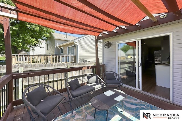 wooden terrace featuring a pergola and outdoor lounge area
