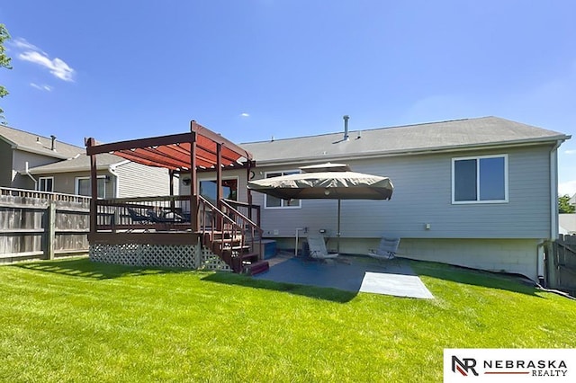 back of house with a pergola, a patio area, and a deck