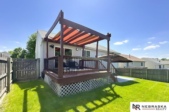 rear view of property with a deck, a gate, and a pergola
