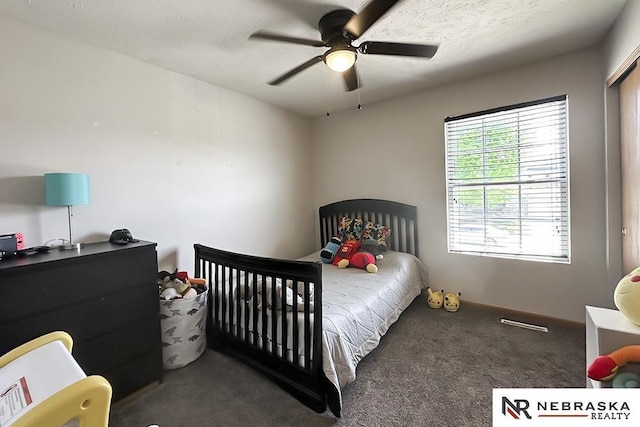 carpeted bedroom featuring a ceiling fan