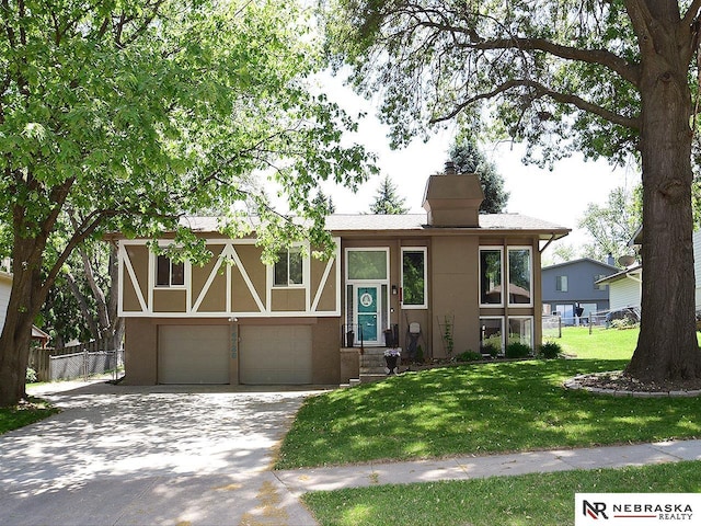 view of front of property featuring stucco siding, a garage, concrete driveway, and a chimney
