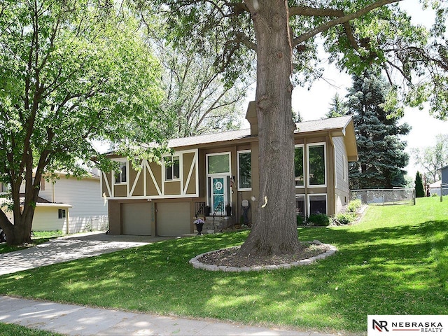 view of front of house with a garage, driveway, and stucco siding