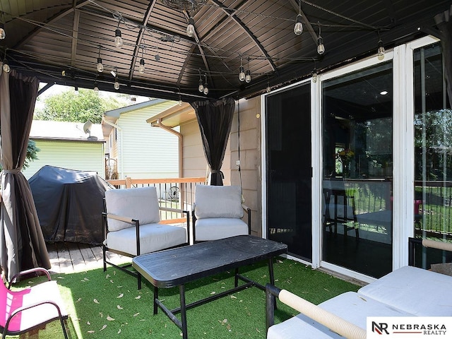 view of patio / terrace with a gazebo, grilling area, and a deck