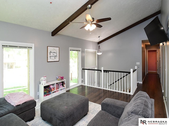 living room with wood finished floors, ceiling fan, and baseboards